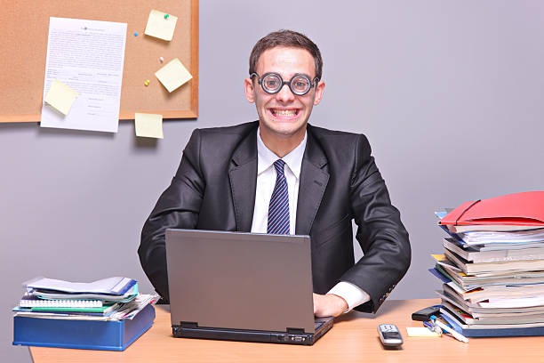 istock Nerdy businessman working on a laptop 152499616
