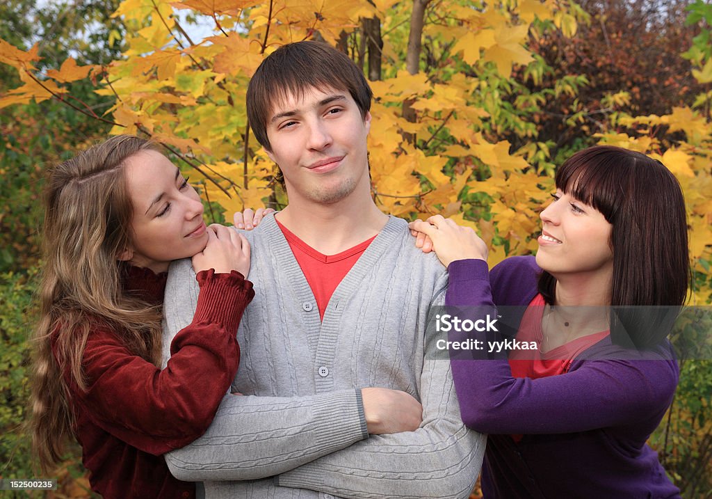Amorousness. In love girls and proud fellow. Adult Stock Photo