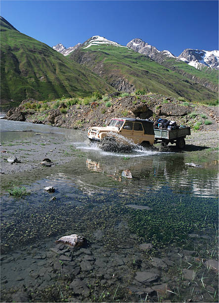 istock Off-road vehicle crossing the river 152500257