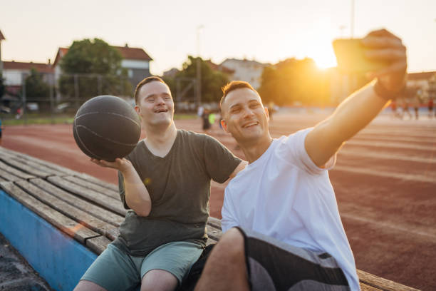 istock Two best friends enjoy a sunny day outdoors taking selfie photos 1525003744