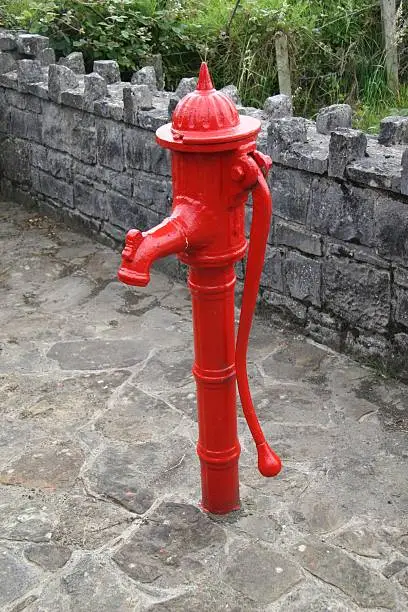 red old waterpump taken in ireland