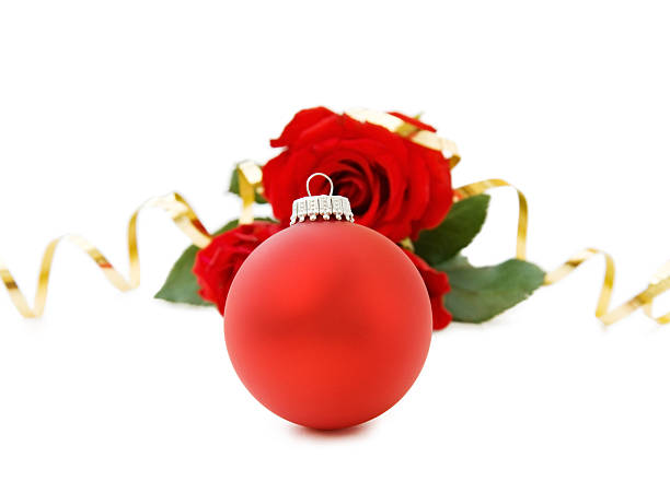 Christmas red bauble and roses stock photo