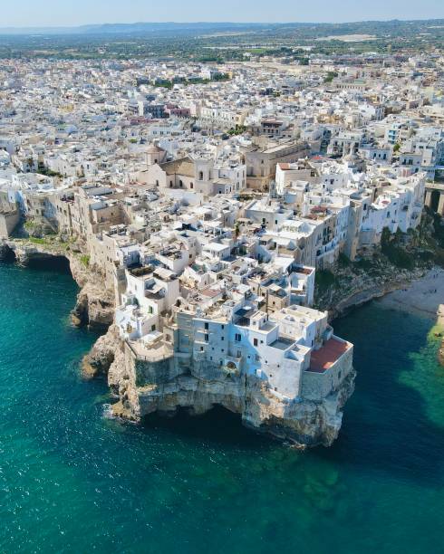 Drone shot of Polignano a Mare, Puglia, Italy Drone shot of Polignano a Mare, Puglia, Italy monopoli puglia stock pictures, royalty-free photos & images