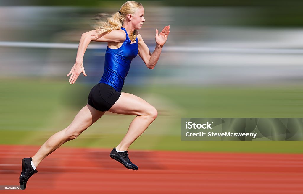 Speed blur Young athlete running down the track with motion blur added. Sprinting Stock Photo
