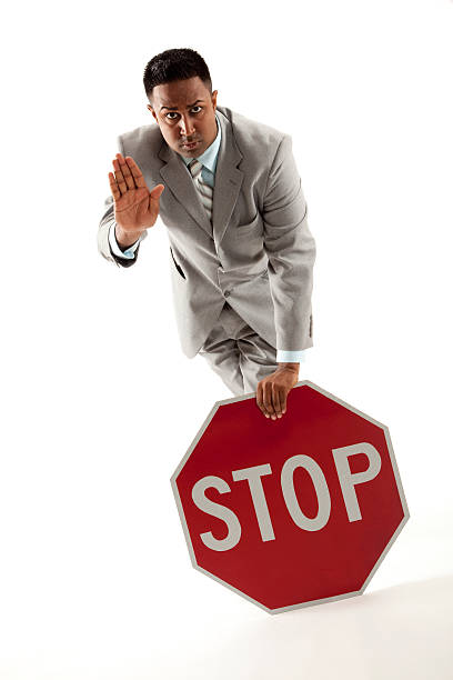 Businessman with stop sign stock photo