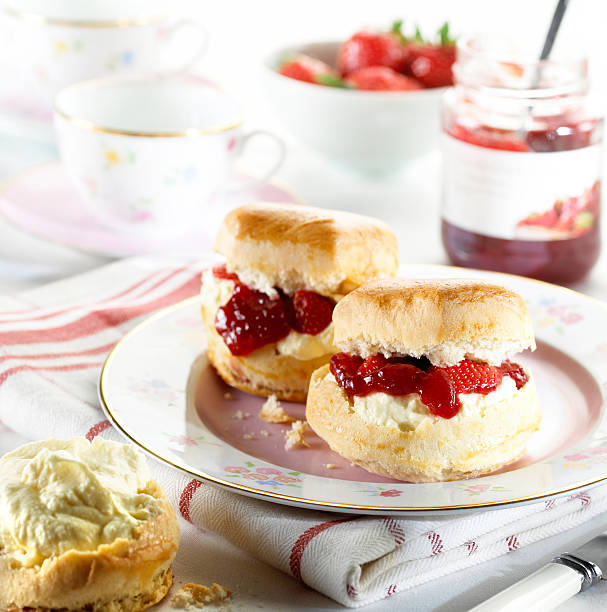 Scones with jam and cream Scones with jam and cream scone photos stock pictures, royalty-free photos & images