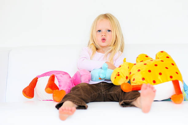istock Toddler girl on white with silly face 152503355