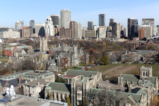 University buildings are in the foreground, and buildings along Yonge and Bay streets in the background.