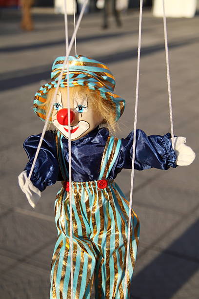 istock Toy clown with red nose. Puppet on a string 152504525