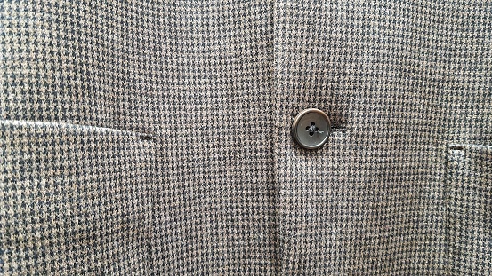 Close up of button on suit
