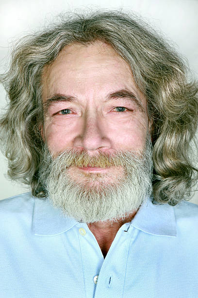 istock grandfather with a beard and long hair smiles 152504872