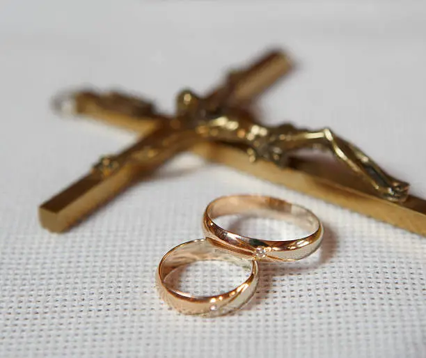 gold wedding-rings with a crucifix