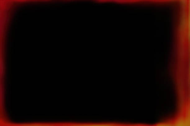 istock Old red and yellow frame on a black background 1525052359