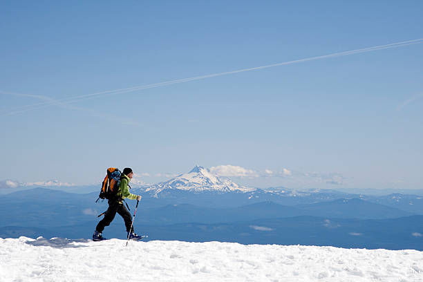 Mountain climber along ridge stock photo