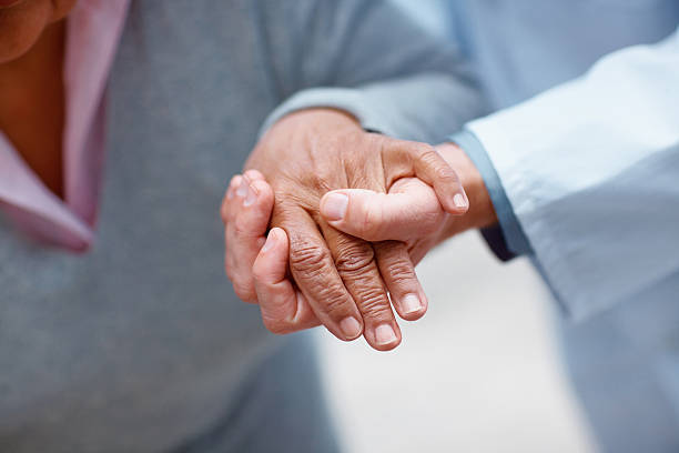istock Doctor holding patient's hand 152505812