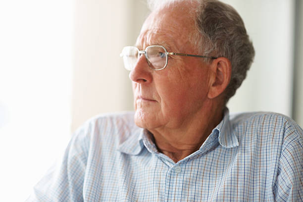 istock Depressed old man looking away in thought 152505820