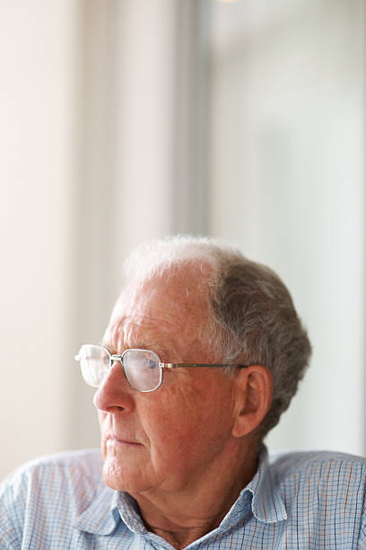 istock Elderly man wearing glasses looking away 152505827