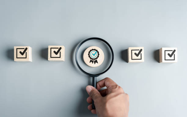 istock Checklist Quality management with Quality Assurance approval guarantee symbol and improvement. Standardization certification. Compliance to regulations service and standards. 1525062413