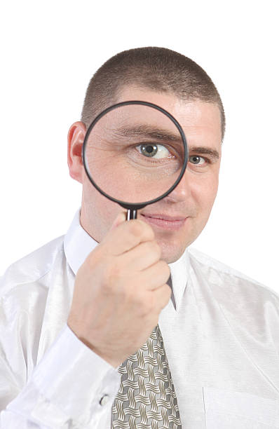 istock businessman with magnifying glass 152506390