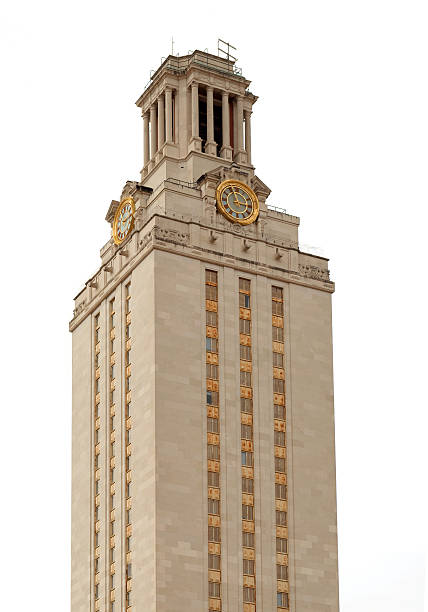 UT University of Texas at Austin Tower The University of Texas at Austin clock tower on a cloudy day.  Perfect for a cutout in a brochure or to wrap text around on a website. clock tower stock pictures, royalty-free photos & images