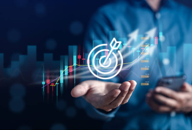 Businessman hand hold target icon to planning development leadership and customer target group to success goal concept.