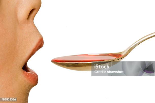 Child Takes A Spoonful Of Medicine Stock Photo - Download Image Now - Profile View, Spoon, Child