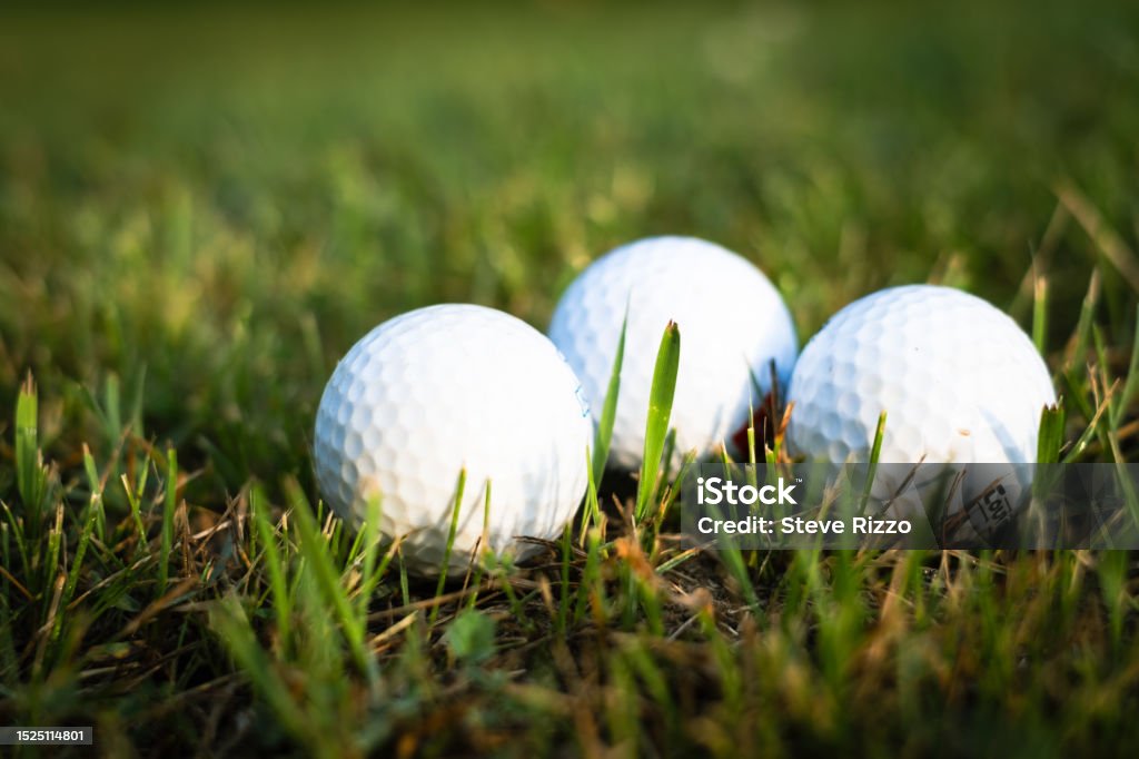 Three golf balls on grass Golf Balls on grass Canada Stock Photo