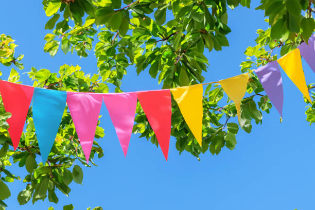 istock Colorful pennant string decoration against summer sky 1525125823