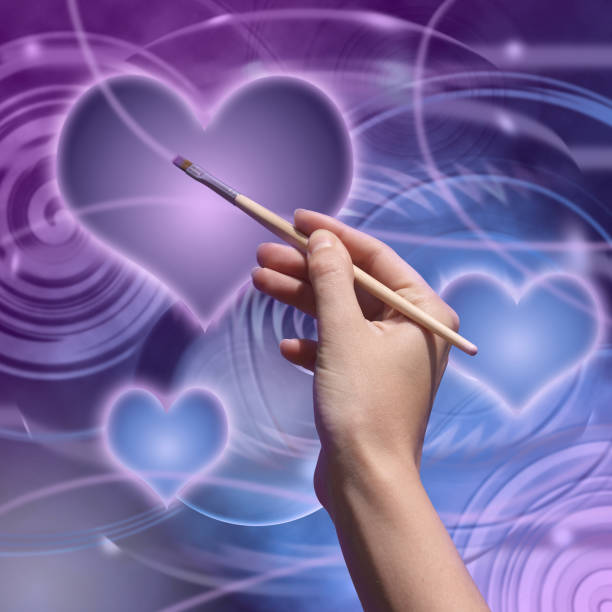 Artist draws a love planet Female hand draws postcard Valentine day. Photocompilation. Photo and hand-drawing elements combined. finger spinning globe stock pictures, royalty-free photos & images