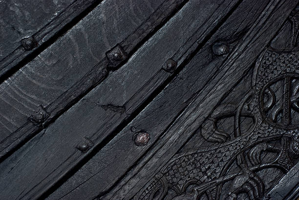 Detail of viking ship Detail of old, Norwegian viking ship, the Oseberg ship, built in Norway in year 820, now on display at the Viking Ship Museum in Oslo, Norway. viking ship photos stock pictures, royalty-free photos & images