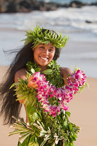 Hawaiian Hula Girl Offers a Flower Lei stock photo