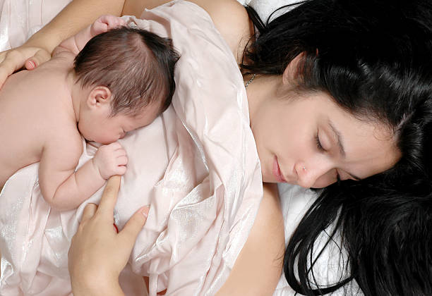 istock Sleeping Baby and Mother 152515830