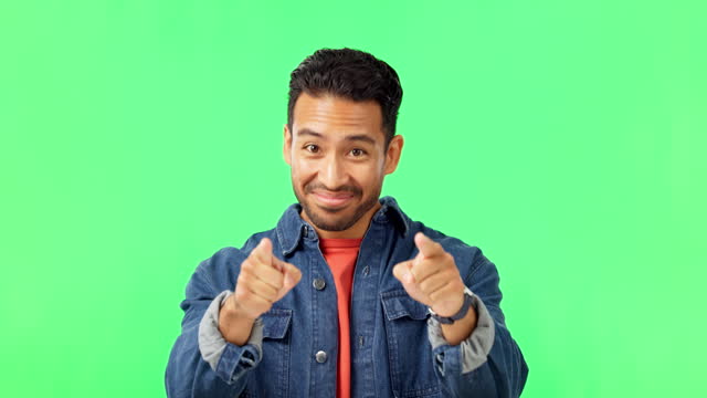 Man, come here hands and smile by green screen with excited face, happy and call by background. Young male, welcome and pointing in portrait with mockup invitation with happiness by studio backdrop