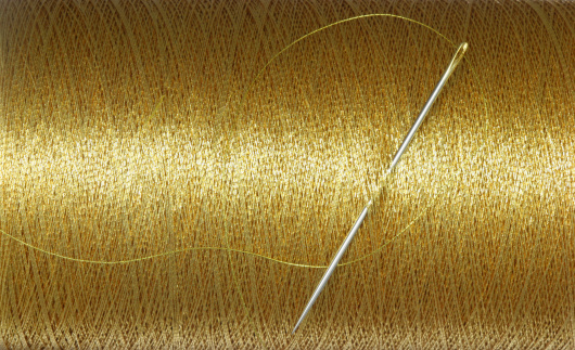 needle and golden thread.