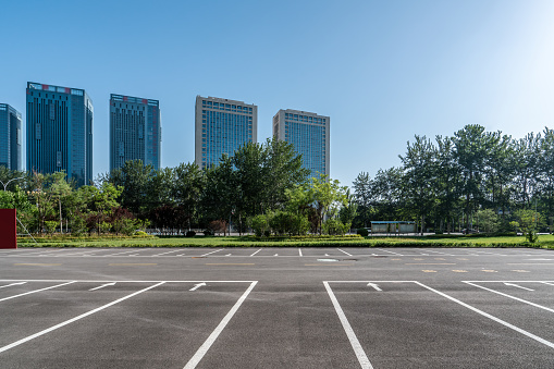 A parking space on an empty asphalt road