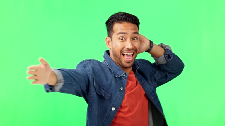 Sprinkler, dance and man portrait in green screen excited with music and smile. Isolated, studio background and happy male model with celebration, energy and dancing with freedom and hip hop move