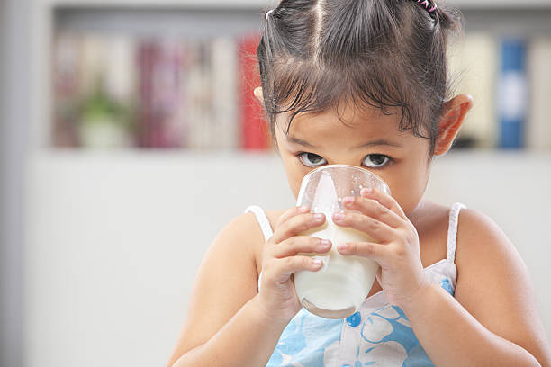 istock Little girl drinking milk 152533681