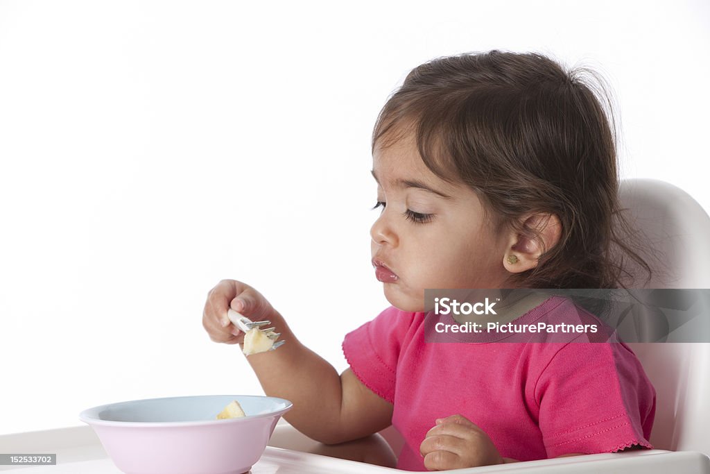 Bebê Menina está comendo pela própria - Foto de stock de Comer royalty-free