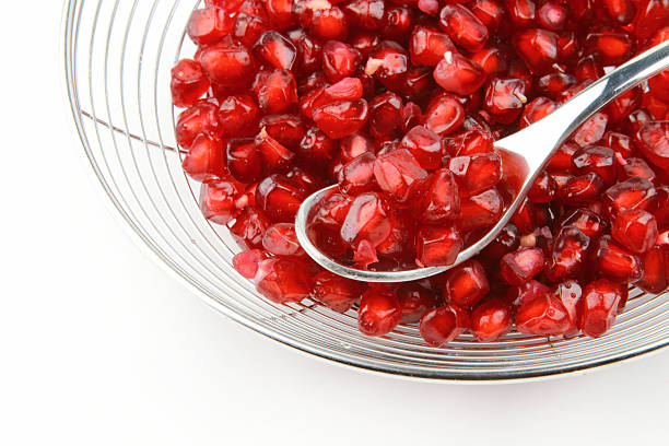 red Pomegranate edible seeds stock photo
