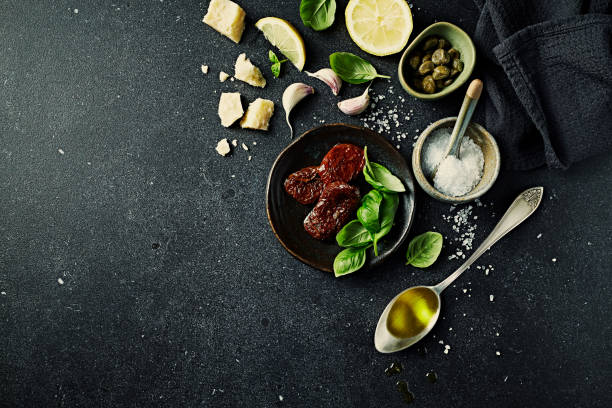 istock Mediterranean food ingredients on dark stone background. Copy space. Flat lay 1525342055