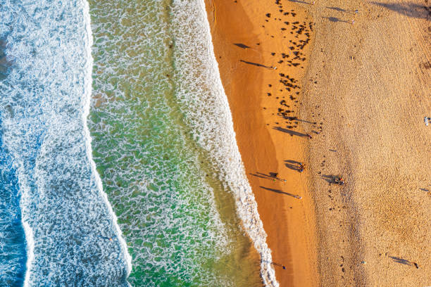 istock Waves crashing on the sandy beach 1525346424
