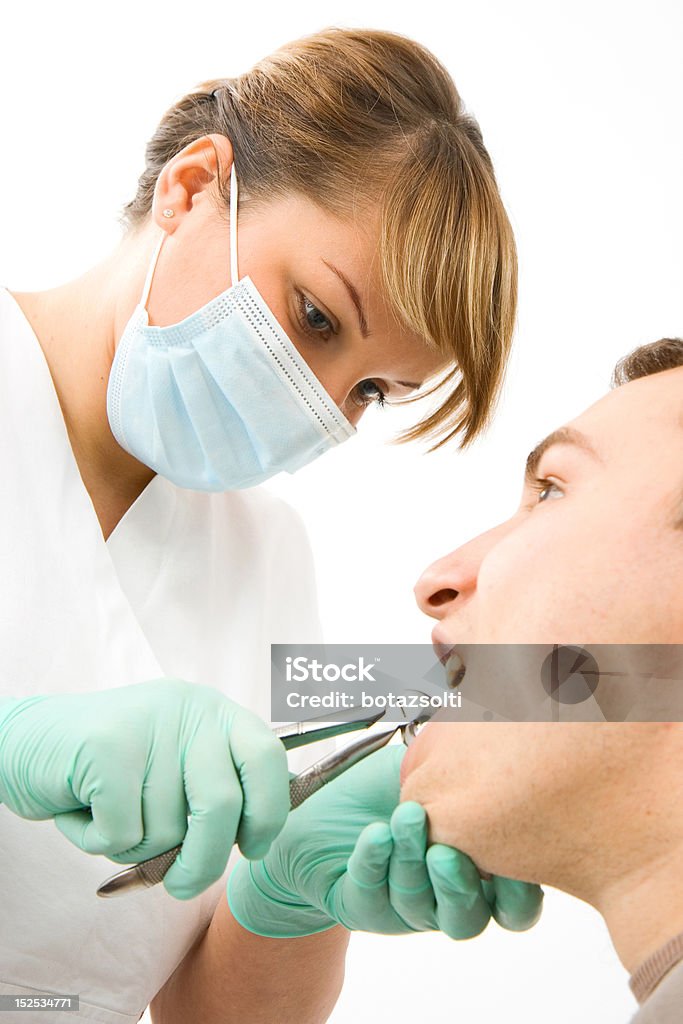 dental extraction patient at the dentist - tooth extraction Adult Stock Photo