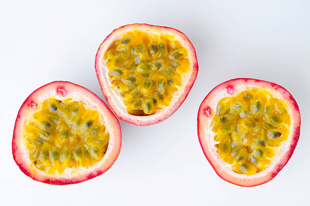 istock Three halves of passion fruit on white background 152535554