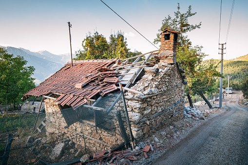 Ruined after earthquake old village stone house