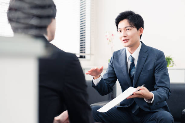 Businessman presenting documents at a business meeting stock photo