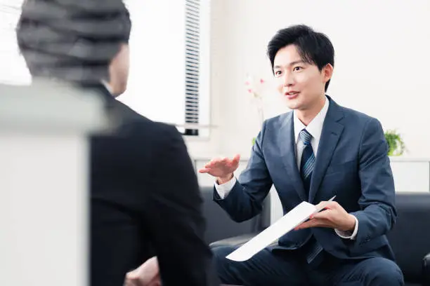 Photo of Businessman presenting documents at a business meeting