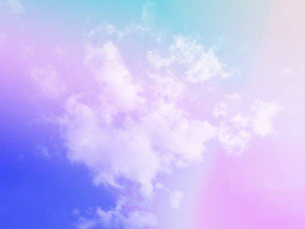 istock beauty sweet pastel soft blue and violet with fluffy clouds on sky. multi color rainbow image. abstract fantasy growing light 1525363120