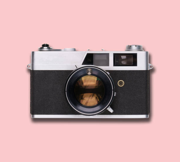 istock vintage old film camera on pink background 1525363579