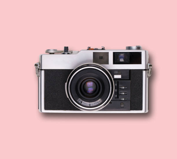 istock vintage old film camera on pink background 1525363581