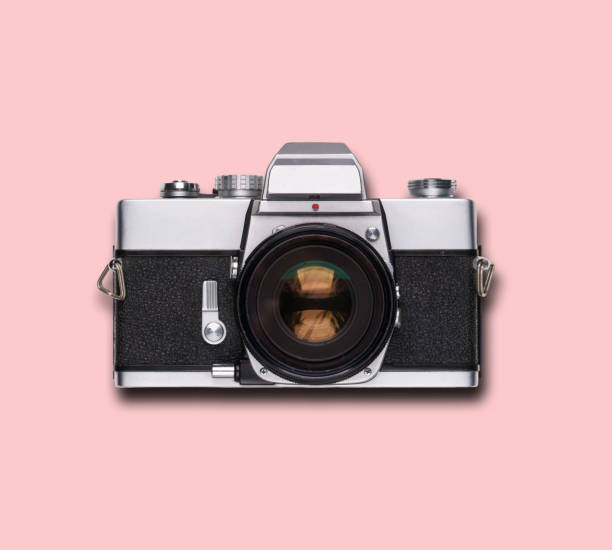 istock vintage old film camera on pink background 1525363582